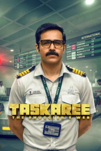 The poster features a determined actor in a police uniform against a gritty, smoky background, conveying action and urgency. The muted tones of the uniform contrast with the fiery sparks, suggesting high-stakes action. The title "Taskaree: The Smuggler's Web" hints at a complex narrative involvin...