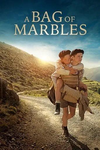 The poster features a couple carrying a marbled bag on a winding dirt road through a sunlit, hilly landscape. The warm golden hour lighting enhances the romantic and adventurous mood, while the earthy tones of the mountains and the marbled texture of the bag evoke a sense of journey and nostalgia.