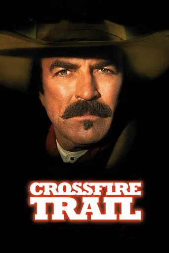 The poster features a rugged cowboy with a mustache and wide-brimmed hat, exuding a gritty, Western mood. The title "Crossfire Trail" is prominently displayed in bold red letters against a dark background, emphasizing the film's title and setting.