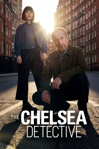 The Chelsea Detective poster features a striking urban scene with two detectives in formal attire against a backdrop of classic London architecture. The cool blue tones of the sky contrast with the warm tones of the city buildings, creating a dramatic and mysterious atmosphere. The reflective wat...
