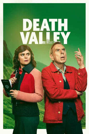 The poster features two characters against a fiery red background, evoking a sense of danger and urgency. The man on the left, dressed in a brown sweater, looks concerned, while the woman beside him, wearing a plaid jacket, appears tense. The bold white text "DEATH VALLEY" dominates the top, sugg...
