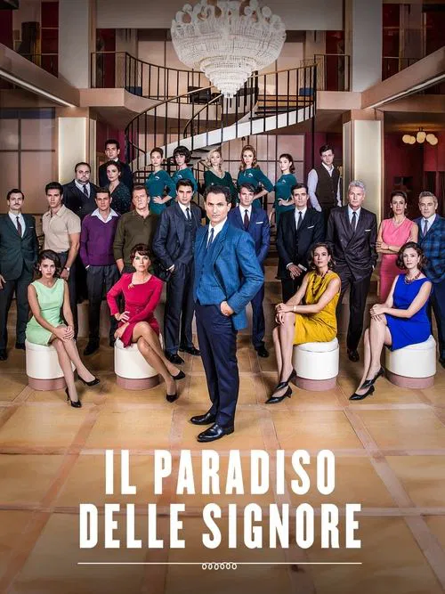The poster features a group of elegantly dressed women and men posing in a grand, opulent room with a chandelier and marble floors. The warm lighting and rich colors create an atmosphere of sophistication and celebration. The title "IL PARADISO DELLE SIGNORE" is prominently displayed at the botto...