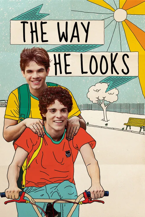 The poster features two boys on a bicycle, one with arms around the other, set against a sunny beach scene with a bench and clouds. The vibrant colors of yellow, orange, and blue create a cheerful, nostalgic atmosphere. The title "The Way He Looks" is prominently displayed in bold letters.