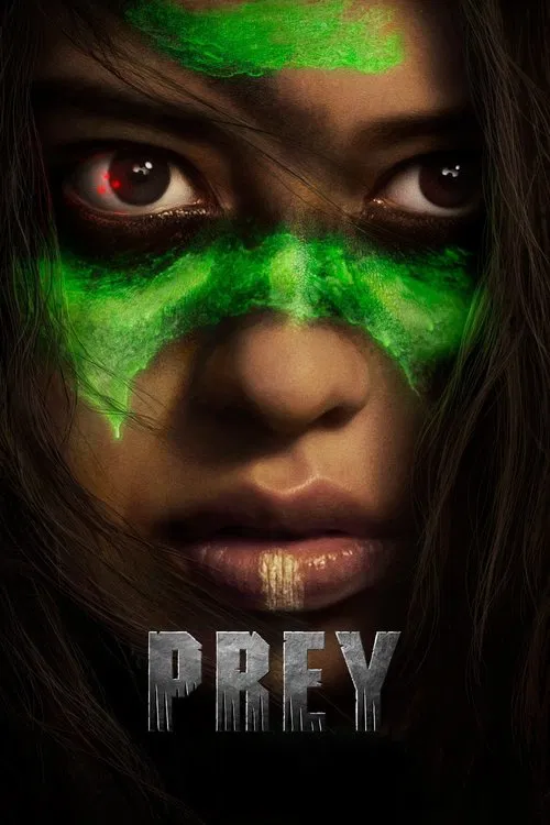 The poster features a woman with intense, piercing eyes and glowing green facial markings, evoking a sense of danger and mystery. The dark background enhances the eerie atmosphere, while the metallic title "PREY" adds a gritty, industrial feel.