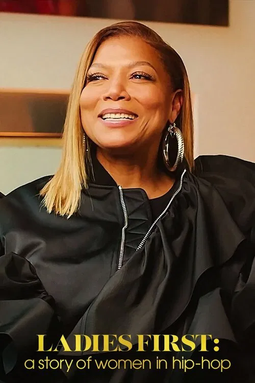The poster features a radiant woman with a warm smile, exuding confidence and grace. Her vibrant blonde hair frames her face, complementing the rich black of her outfit. The bold, golden text at the bottom announces the show's title, creating a striking contrast against the soft background. The o...