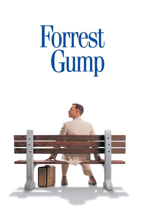 The poster features a man in a beige suit sitting on a wooden bench against a soft blue background, evoking a sense of calm and nostalgia. The title "Forrest Gump" is prominently displayed in elegant typography, with a feather symbolizing the story's themes of freedom and dreams. The overall comp...