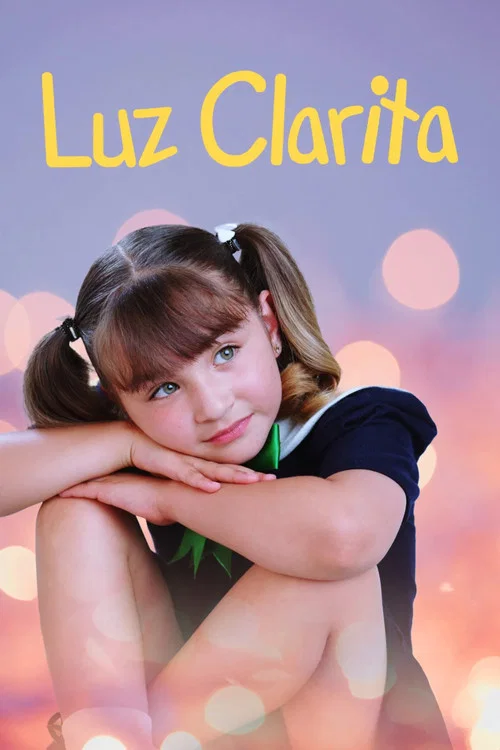 The poster features a young girl with a cheerful expression, her hands resting on her cheeks. She wears a light blue dress with white trim, set against a vibrant blue background with starburst effects. The title "Luz Clarita" is prominently displayed in bold yellow letters at the bottom.