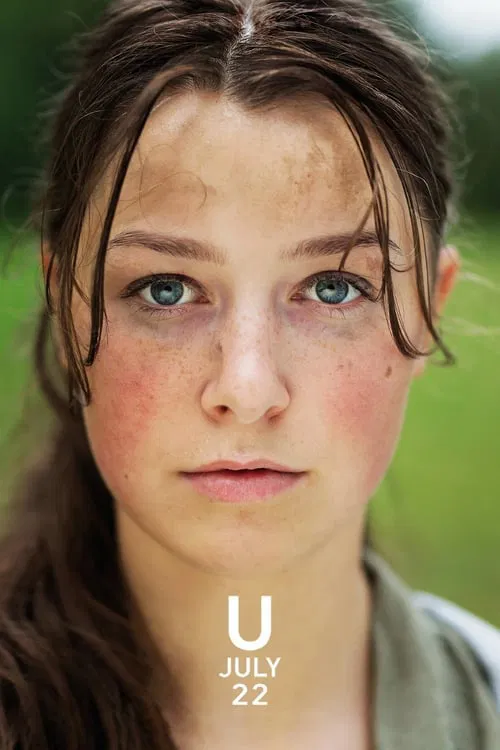 The poster features a young woman with pale skin and freckles, her hair tied back, looking directly at the camera with a somber expression. The muted green background suggests a natural, possibly rural setting. The text "U" and "JULY 22" adds a sense of mystery and intrigue.