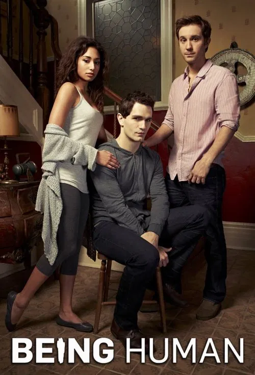The poster features three characters in a warmly lit room with soft lighting and muted tones. The central figure sits on a chair, while the others stand beside him, creating a sense of intimacy and connection. The overall mood is one of quiet drama, suggesting a story about relationships and pers...