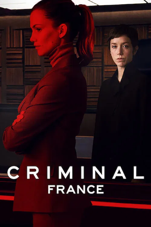 The poster features two characters standing against a dark, moody background. One woman in a red outfit dominates the left side, while the other stands to the right. The warm red lighting casts dramatic shadows, creating an intense and mysterious atmosphere. The title "Criminal: France" is promin...