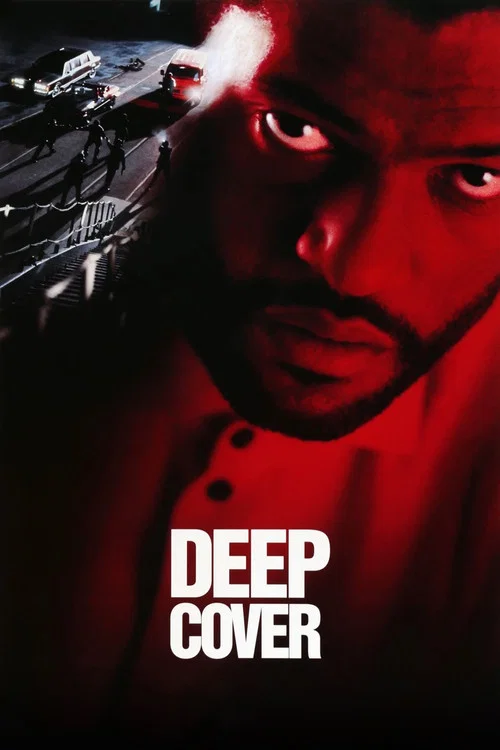 The poster features a close-up of a man with intense red eyes, set against a dark background. The title "DEEP COVER" is prominently displayed in bold white letters. The overall mood is mysterious and suspenseful, with hints of action and danger.