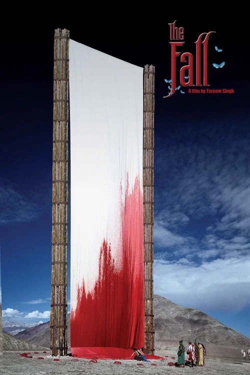 The poster features a man in a black hat and gold chain against a bold red background, with his hand raised in a gesture of defiance. The large white text "THE FALL" dominates the design, conveying a sense of urgency and drama.