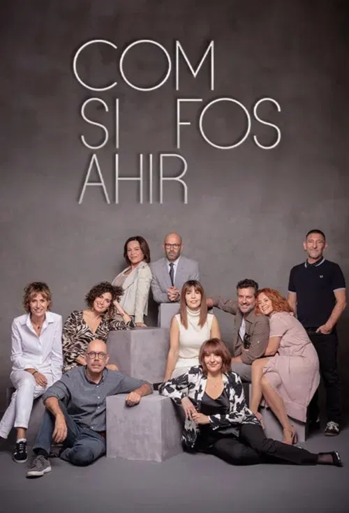 The poster features a group of nine people posing on a gray concrete structure, exuding a relaxed and professional atmosphere. The muted gray background contrasts with the white text, creating a modern and minimalist aesthetic. The diverse group, dressed in varied but polished attire, suggests a ...
