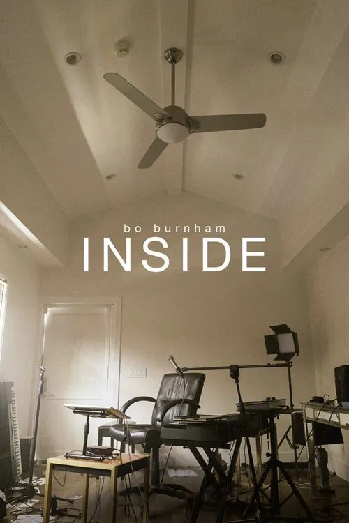 The poster captures a dimly lit, cozy interior with warm beige tones and soft shadows. A ceiling fan hangs from the white ceiling, casting gentle light across the room. People are not visible, but the atmosphere suggests a relaxed, intimate space—perhaps a home office or living area. The mood is ...