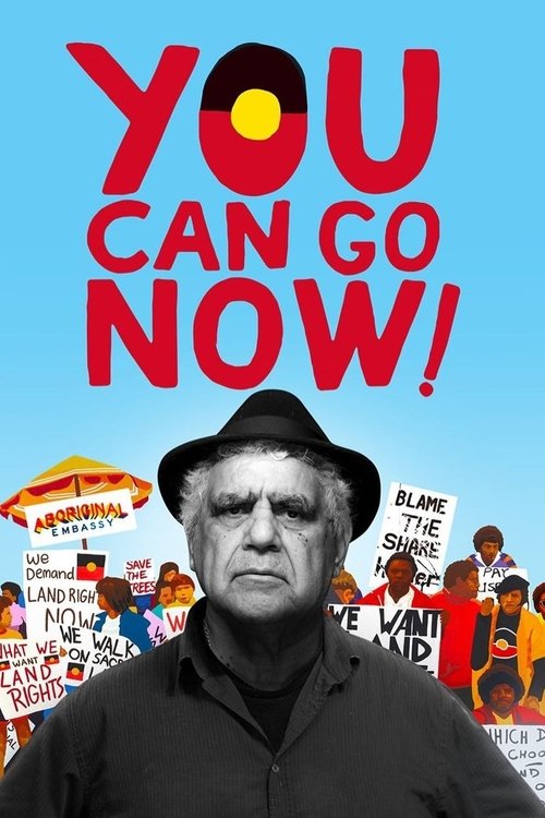 The poster features a stern man in a black hat against a vibrant blue sky, surrounded by colorful figures holding signs with messages like "Blame the Wind" and "We're Not Going." The bold red text "YOU CAN GO NOW!" dominates the top, conveying urgency and hope. The overall mood is energetic yet d...