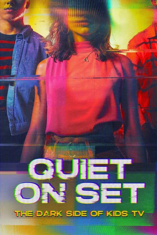 The poster features two young people standing side by side, one in a denim jacket and the other in a pink top. The background is filled with vibrant, saturated colors like red, yellow, and green, creating a lively and energetic atmosphere. The title "QUIET ON SET" is prominently displayed in bold...